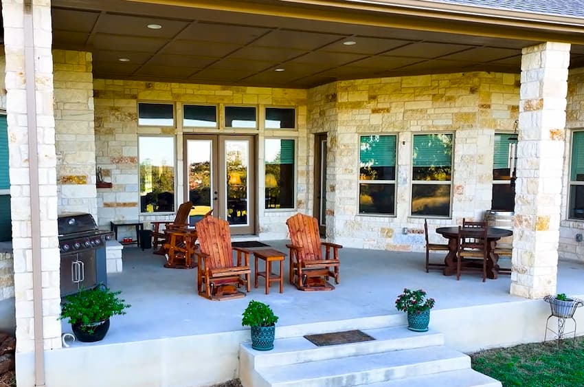 Guests relaxing on the back patio at Porter Haus, overlooking the Hill Country